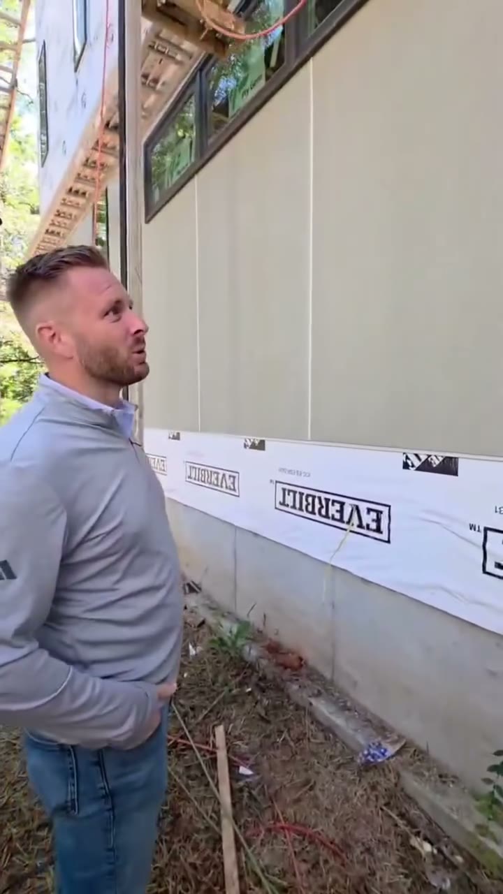 Diaz crew measuring lap siding during an install